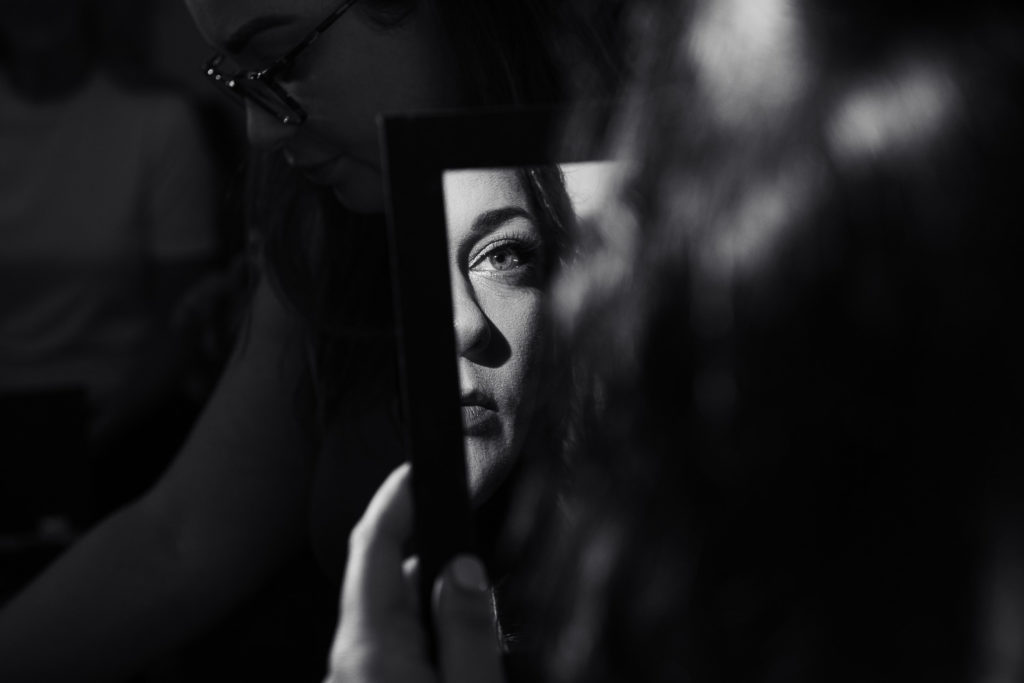 bride looking in mirror