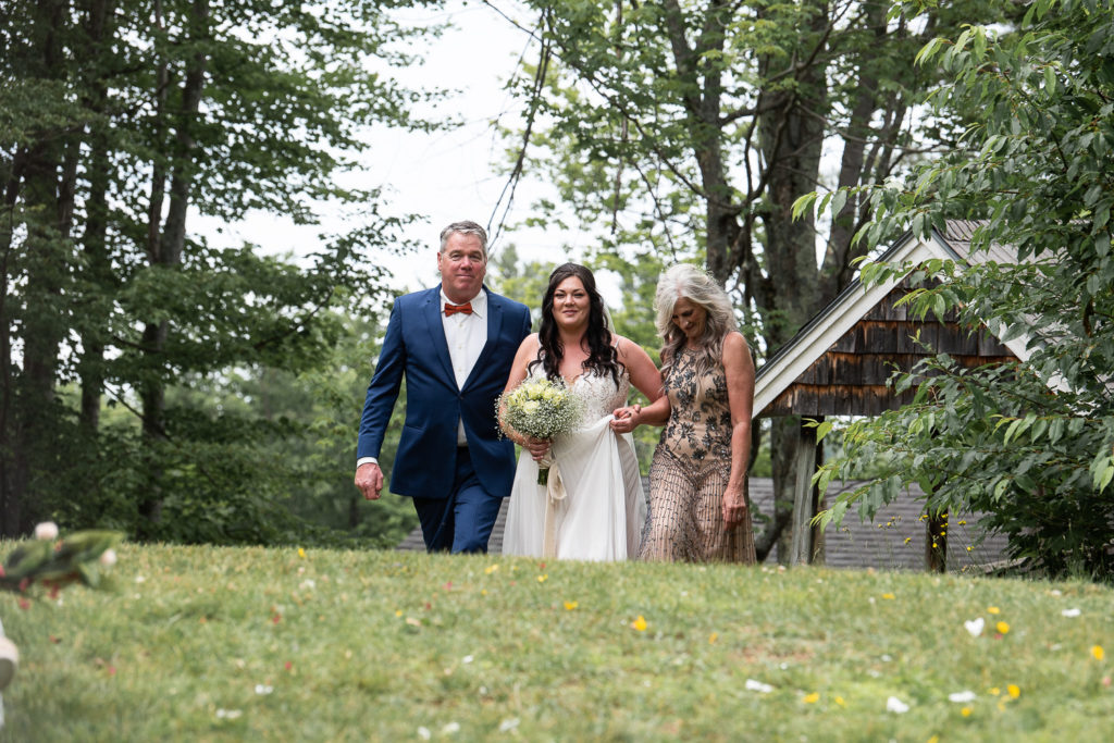 bride with parents during wedding processional