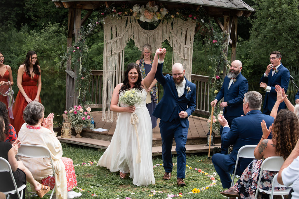 bride and groom celebrating during wedding ceremony